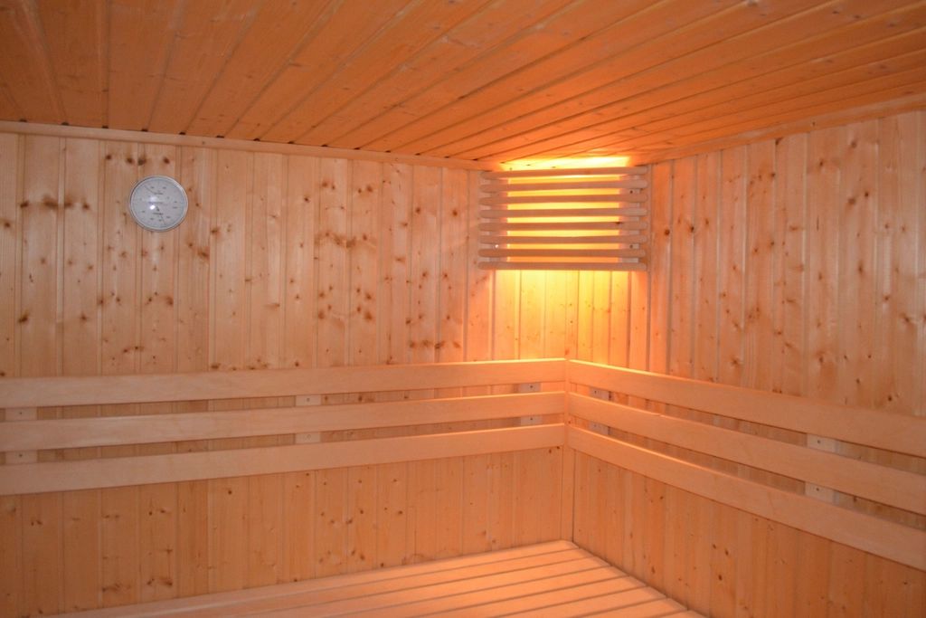 The sauna and steam room, lined in timber